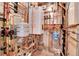 Utility room featuring a hot water heater with pipes and gauges, along with other mechanical systems at 960 S Arbutus St, Lakewood, CO 80228