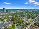An aerial view shows mature tree coverage around this home near a metropolitan area at 1080 S Garfield St, Denver, CO 80209