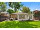 This home features a well-manicured backyard with a patio area, perfect for outdoor relaxation and entertaining at 1080 S Garfield St, Denver, CO 80209