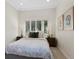 Bright bedroom with shutters, bedside tables, and a comfortable bed creating a cozy retreat at 1080 S Garfield St, Denver, CO 80209