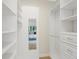 Custom closet with built-in shelving, drawers, and a mirror provides an organized and stylish space at 1080 S Garfield St, Denver, CO 80209