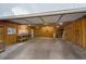 Unfinished garage interior showing overhead door mechanism, concrete floor and exposed framing at 1080 S Garfield St, Denver, CO 80209