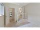 Hallway with staircase leading to other areas, plus a glimpse of a bedroom, provides connectivity at 1080 S Garfield St, Denver, CO 80209