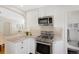 Bright kitchen featuring stainless appliances, light countertops, and modern finishes at 1080 S Garfield St, Denver, CO 80209