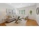 Bright living room with hardwood floors, neutral decor, and ample natural light at 1080 S Garfield St, Denver, CO 80209