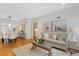 Open concept living and dining room with hardwood floors and neutral color palette at 1080 S Garfield St, Denver, CO 80209