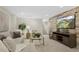 Comfortable living room featuring modern furnishings, a decorative accent wall, recessed lighting, and neutral carpeting at 1080 S Garfield St, Denver, CO 80209