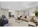 Spacious living room with a cozy seating area, desk, and a decorative coffee table at 1080 S Garfield St, Denver, CO 80209