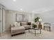 Bright living room with recessed lighting, neutral walls, modern furniture, and decorative plants with light carpet at 1080 S Garfield St, Denver, CO 80209