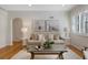 Stylish living room with hardwood floors, modern artwork, and comfortable seating at 1080 S Garfield St, Denver, CO 80209