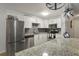 Bright kitchen with stainless steel appliances, granite countertops, and modern fixtures at 1260 York St # 102, Denver, CO 80206