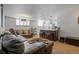 Comfortable living room with leather seating, stylish lighting, and an island with barstool seating at 1260 York St # 102, Denver, CO 80206