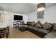 Living area boasts a large leather sectional sofa, media console, and stylish artwork for comfortable living at 1260 York St # 102, Denver, CO 80206