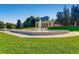 Scenic view of the park with a central fountain, manicured lawns, and classical architecture in the background at 1260 York St # 102, Denver, CO 80206