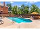 Enjoy a refreshing swim in the community pool with views of the surrounding brick buildings and landscaping at 1260 York St # 102, Denver, CO 80206