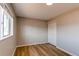 Bright bedroom with closet and two windows providing ample natural light at 7856 Ladore St, Commerce City, CO 80022