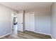 Bedroom with hardwood floors and closet at 7856 Ladore St, Commerce City, CO 80022