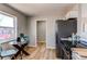 Cozy breakfast nook with round glass table and chairs adjacent to the kitchen at 7856 Ladore St, Commerce City, CO 80022