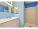 Clean bathroom with white vanity and shower at 261 S Newark Cir, Aurora, CO 80012