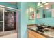 Modern bathroom with glass sink and dark tile at 261 S Newark Cir, Aurora, CO 80012