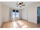 Light and airy bedroom with wood floors and ceiling fan at 261 S Newark Cir, Aurora, CO 80012