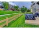 Backyard with lush green grass, walking path, and view of nearby residences at 3070 Redhaven Way, Highlands Ranch, CO 80126