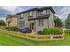 Spacious backyard with a wood fence, green lawn, patio, and lush landscaping for outdoor enjoyment at 3070 Redhaven Way, Highlands Ranch, CO 80126
