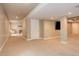 Large basement area features neutral carpet, recessed lighting, and column support at 3070 Redhaven Way, Highlands Ranch, CO 80126