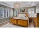 Tranquil bedroom with natural light, a chandelier, and a wooden furniture set at 3070 Redhaven Way, Highlands Ranch, CO 80126