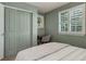 This bedroom is bright with a large window and closet with a desk and chair tucked in the corner at 3070 Redhaven Way, Highlands Ranch, CO 80126