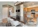 Open-concept dining area with wood floors, modern lighting, and views into the kitchen at 3070 Redhaven Way, Highlands Ranch, CO 80126