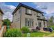 Two-story home exterior with backyard patio, lawn, and colorful landscaping at 3070 Redhaven Way, Highlands Ranch, CO 80126
