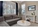 Comfortable living room with shuttered windows, a sectional sofa, and stylish decor at 3070 Redhaven Way, Highlands Ranch, CO 80126