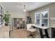 Attached office area with modern desk, ample shelving, and large window with shutter providing lots of natural light at 3070 Redhaven Way, Highlands Ranch, CO 80126