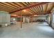 Spacious unfinished basement with concrete floor, exposed ceiling and multiple windows at 5480 Craftsman Dr, Parker, CO 80134