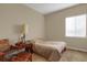Bedroom featuring a bed, wooden furniture, and a window at 5480 Craftsman Dr, Parker, CO 80134