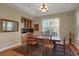 Inviting dining room featuring hardwood floors, built in cabinets and plenty of natural light at 5480 Craftsman Dr, Parker, CO 80134