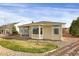Back exterior view of home featuring a well maintained yard and natural lighting at 5480 Craftsman Dr, Parker, CO 80134