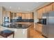Kitchen boasts stainless steel appliances, granite countertops, and custom cabinetry at 5480 Craftsman Dr, Parker, CO 80134