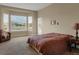 Relaxing main bedroom featuring a large bay window and comfortable seating at 5480 Craftsman Dr, Parker, CO 80134