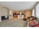 Bright and open floorplan with a seamless flow between the living and kitchen areas at 5480 Craftsman Dr, Parker, CO 80134