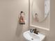 Bathroom features a sink, mirror, and decorative fixtures at 5480 Craftsman Dr, Parker, CO 80134