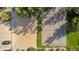 Aerial view of a sand volleyball pit and basketball court showing layout and surrounding greenery at 12760 Ironstone Way # 103, Parker, CO 80134