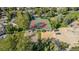 Aerial view of tennis courts, basketball courts and sand volleyball pit in this community at 12760 Ironstone Way # 103, Parker, CO 80134