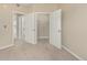 Bedroom with two open closets, neutral walls, and carpet flooring at 12760 Ironstone Way # 103, Parker, CO 80134