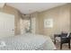 Comfortable bedroom featuring a patterned bed, accent chair, and serene decor, providing a peaceful retreat at 12760 Ironstone Way # 103, Parker, CO 80134