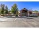 Attractive exterior view of the community building with professional landscaping and designated parking at 12760 Ironstone Way # 103, Parker, CO 80134