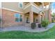 A low angle shot of a well maintained brick building with a small porch at 12760 Ironstone Way # 103, Parker, CO 80134