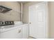 Laundry room featuring washer, dryer, and a storage shelf above at 12760 Ironstone Way # 103, Parker, CO 80134