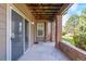 Private patio area with brick accents, offering a serene outdoor space and sliding door access to the interior at 12760 Ironstone Way # 103, Parker, CO 80134